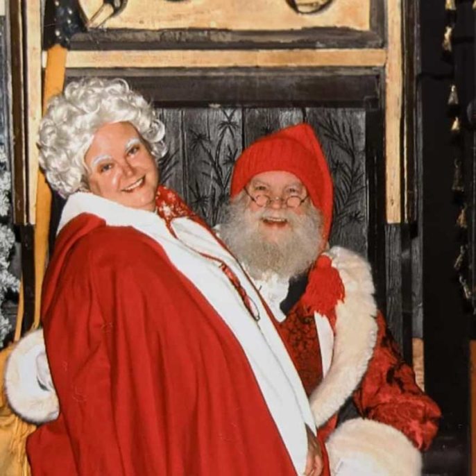Mrs. Claus sitting in Santa's lap